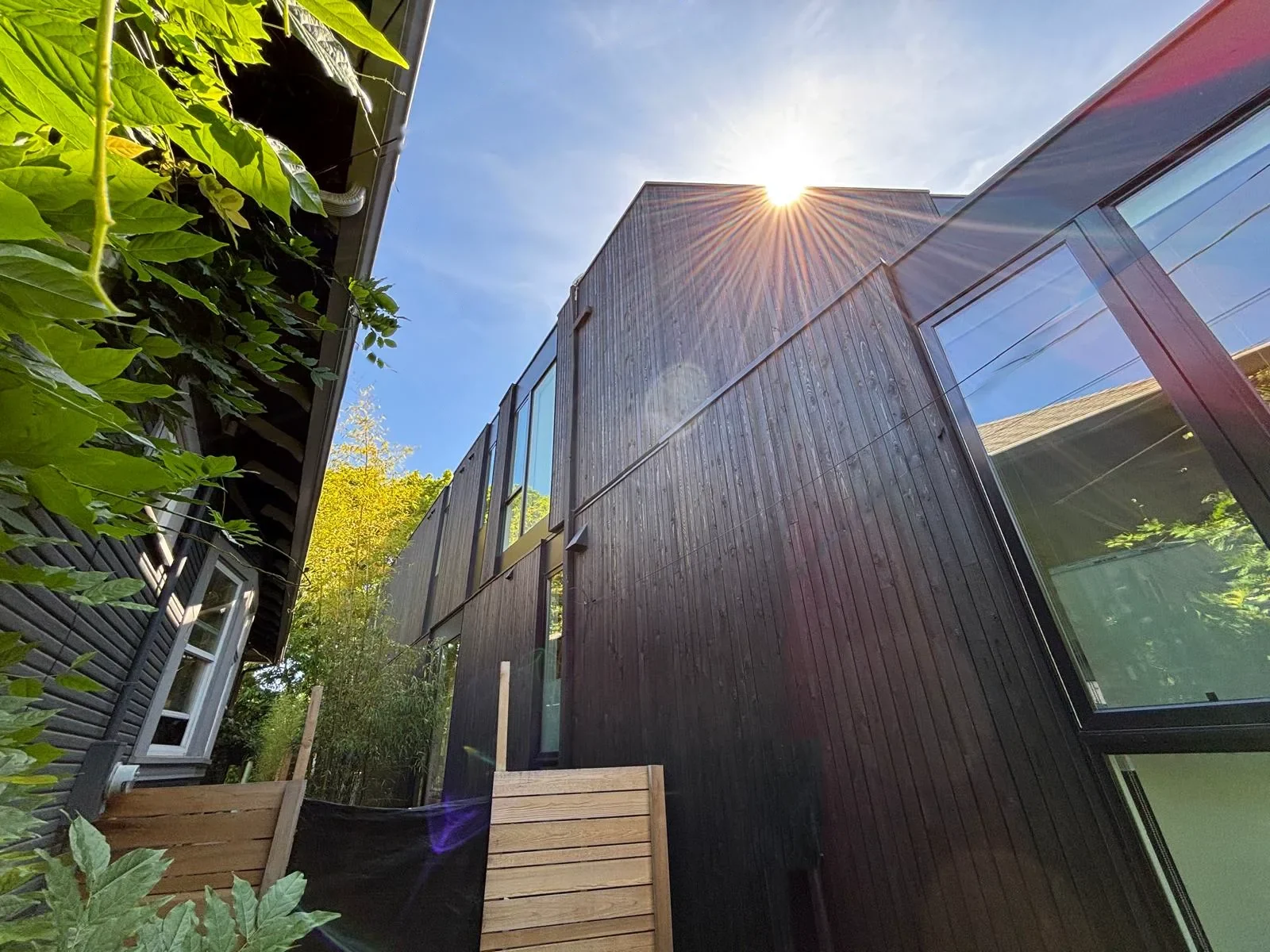 Completed commercial siding project, dark cladding and cedar, Portland metro